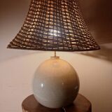 Ceramic lamp with rattan lampshade.