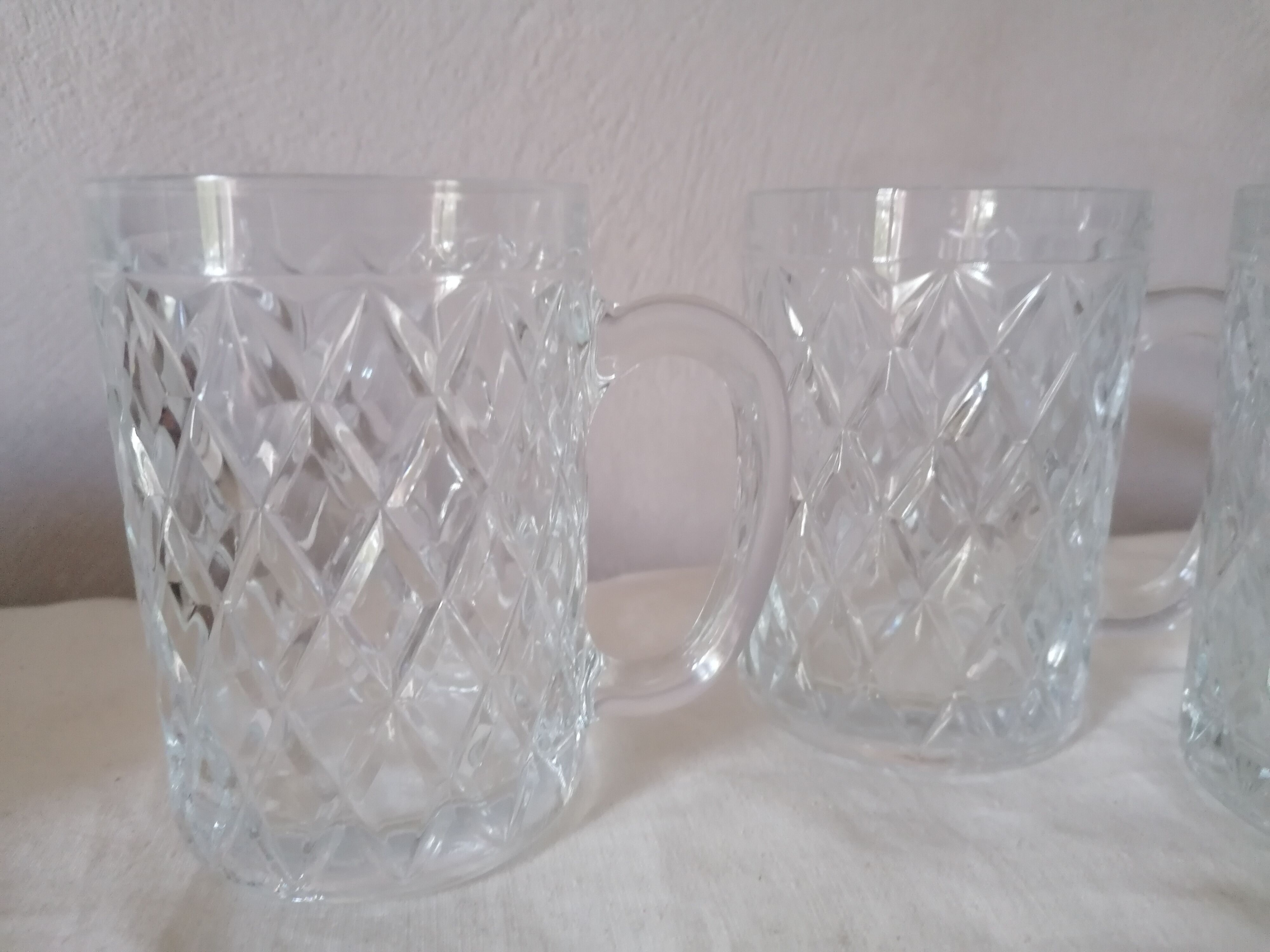 3 diamond-patterned glass mugs