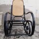 Rocking-chair noir canné bois courbé 1930