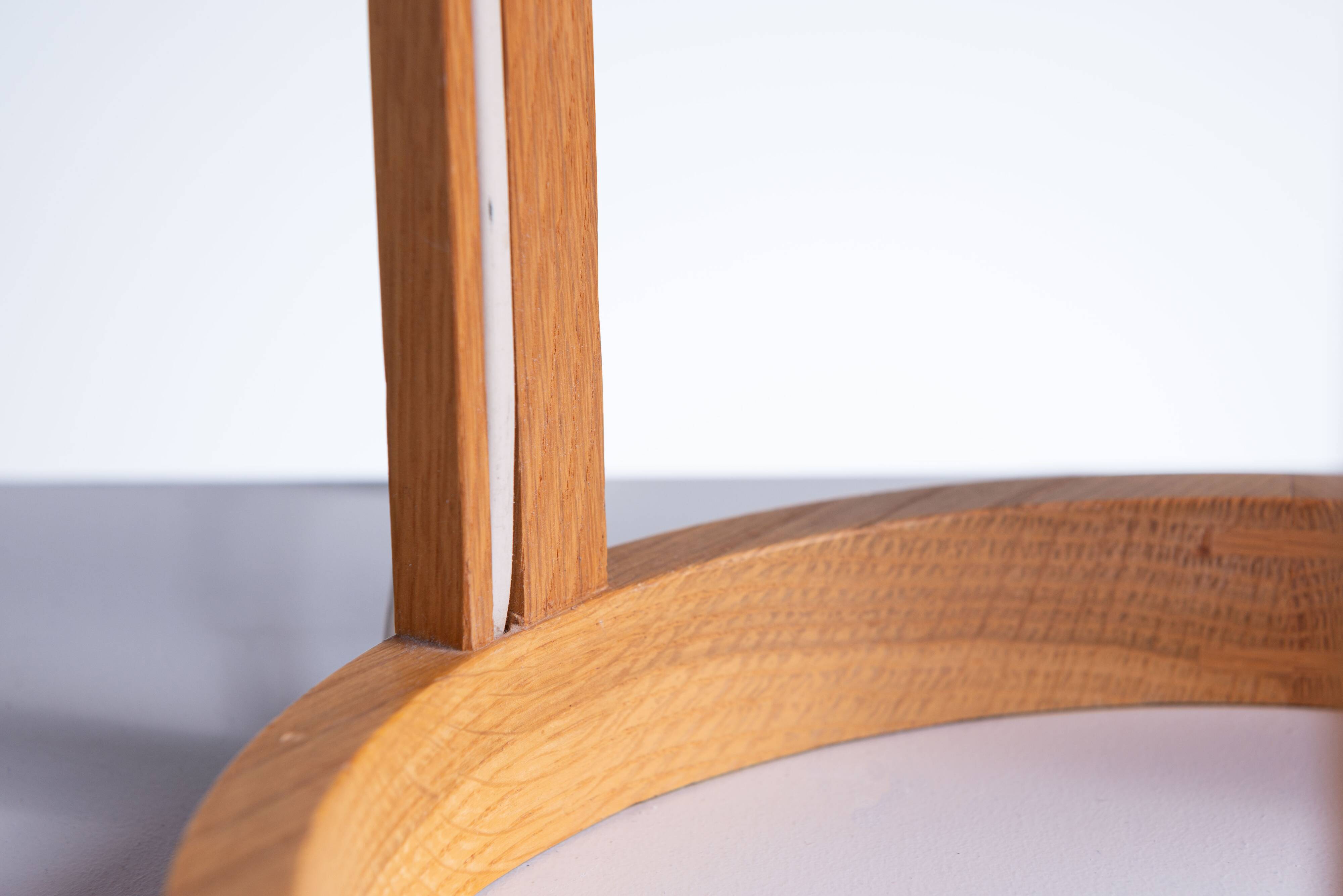 Bent oak wood table lamp with orange glass shade