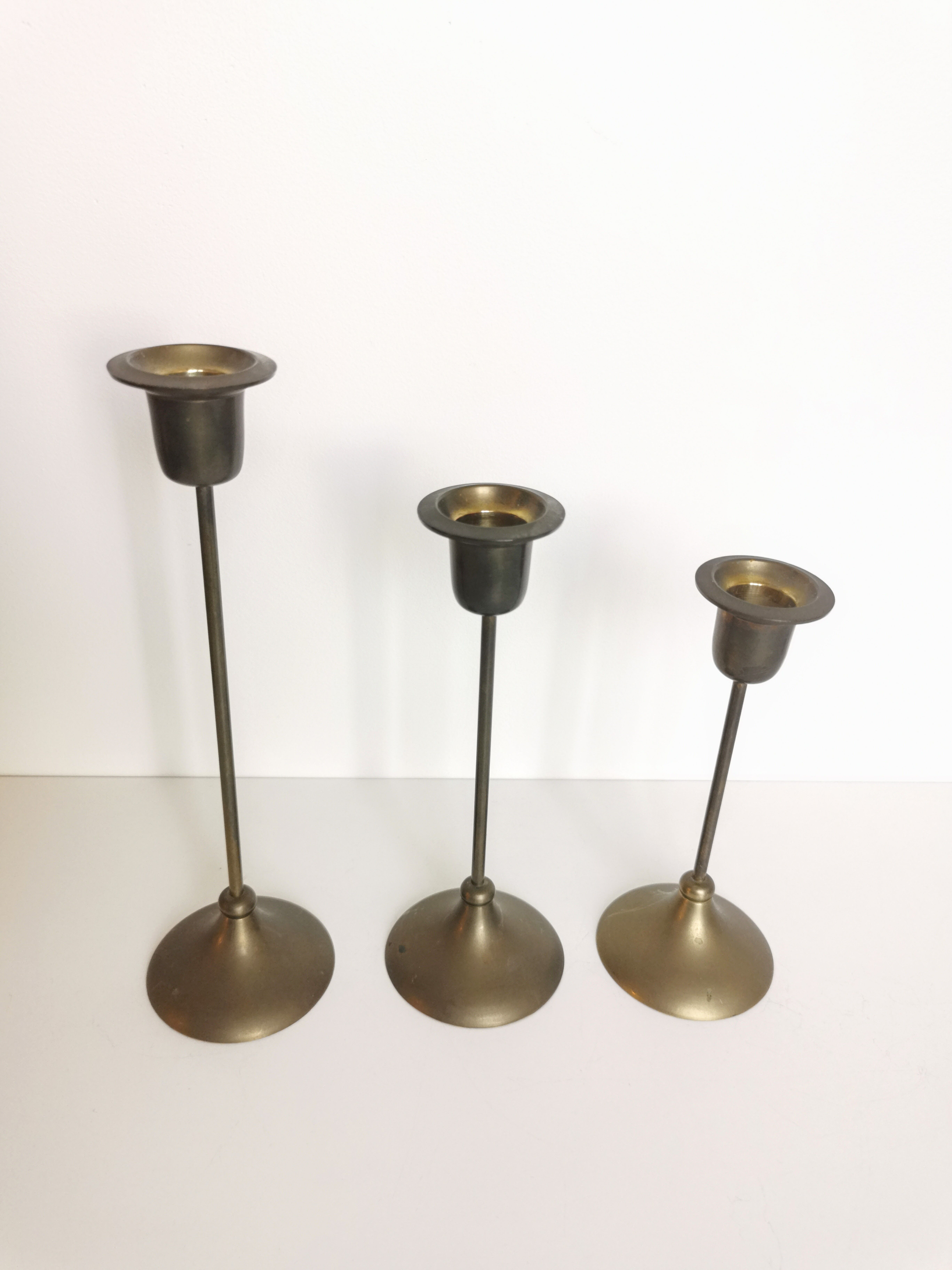 Trio of brass candlesticks