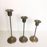 Trio of brass candlesticks