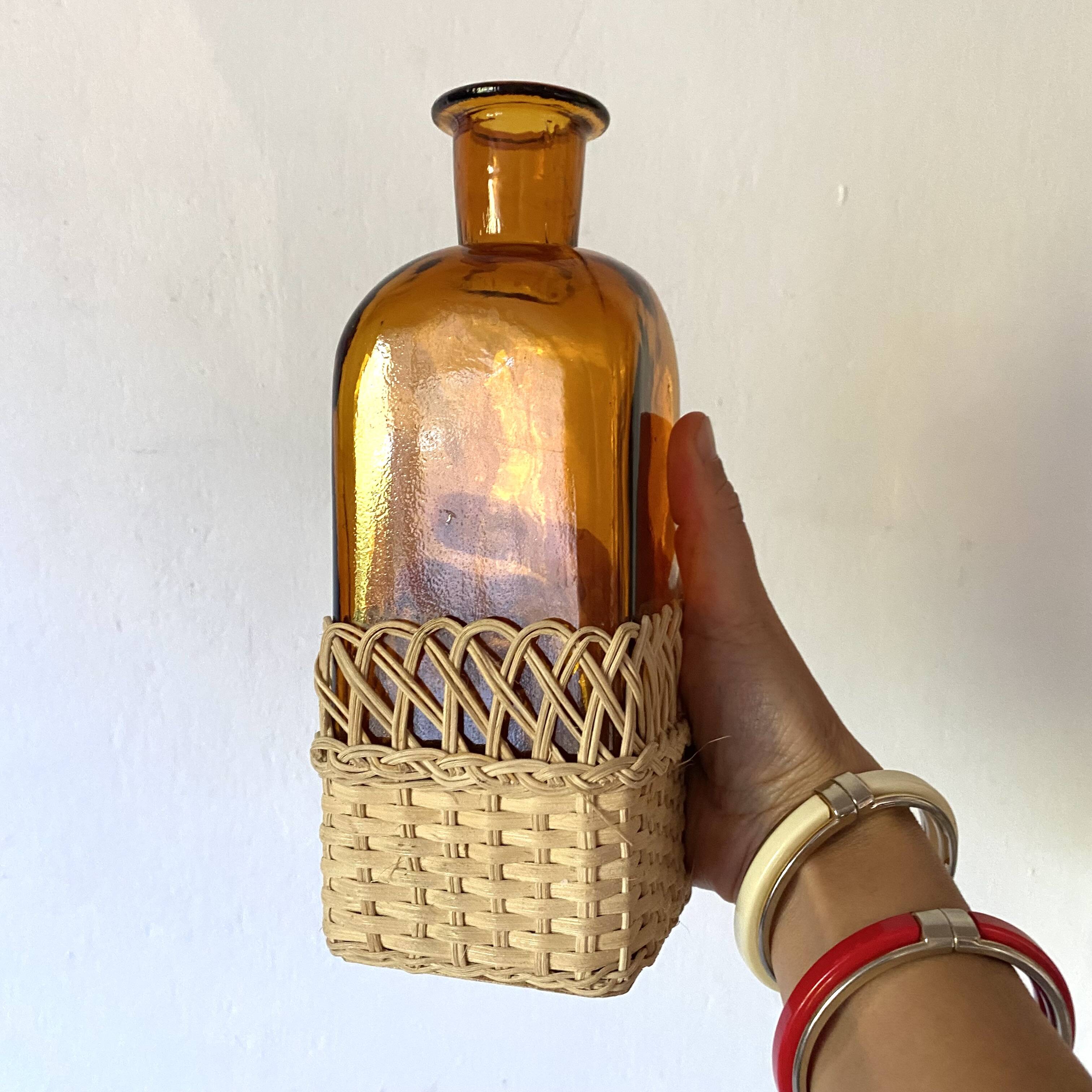 Amber glass and rattan carafe