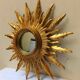 Sun mirror in carved gilded wood from the 1950s