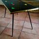 Table basse avec pieds compas