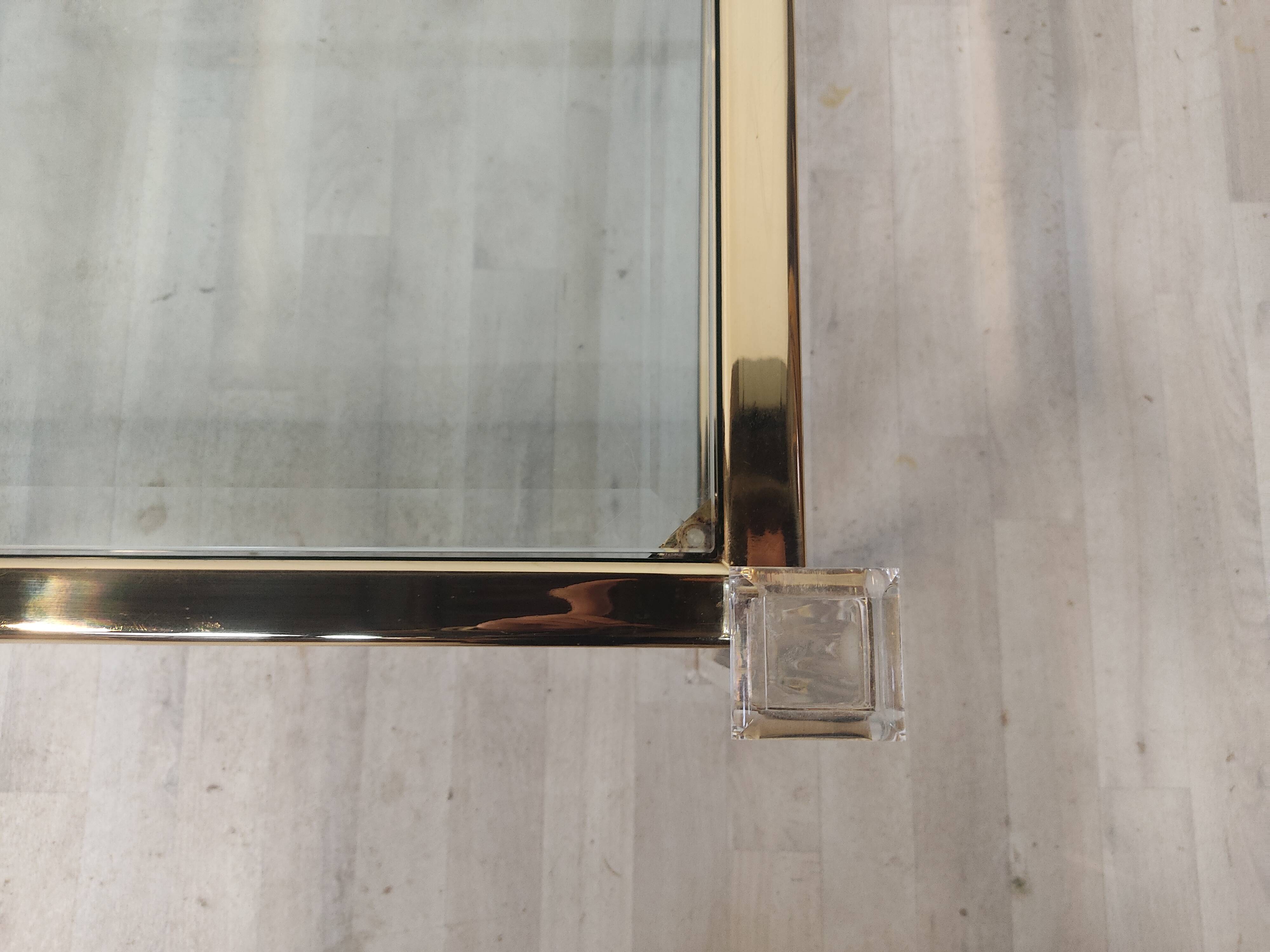 Brass coffee table, beveled glass and altuglas