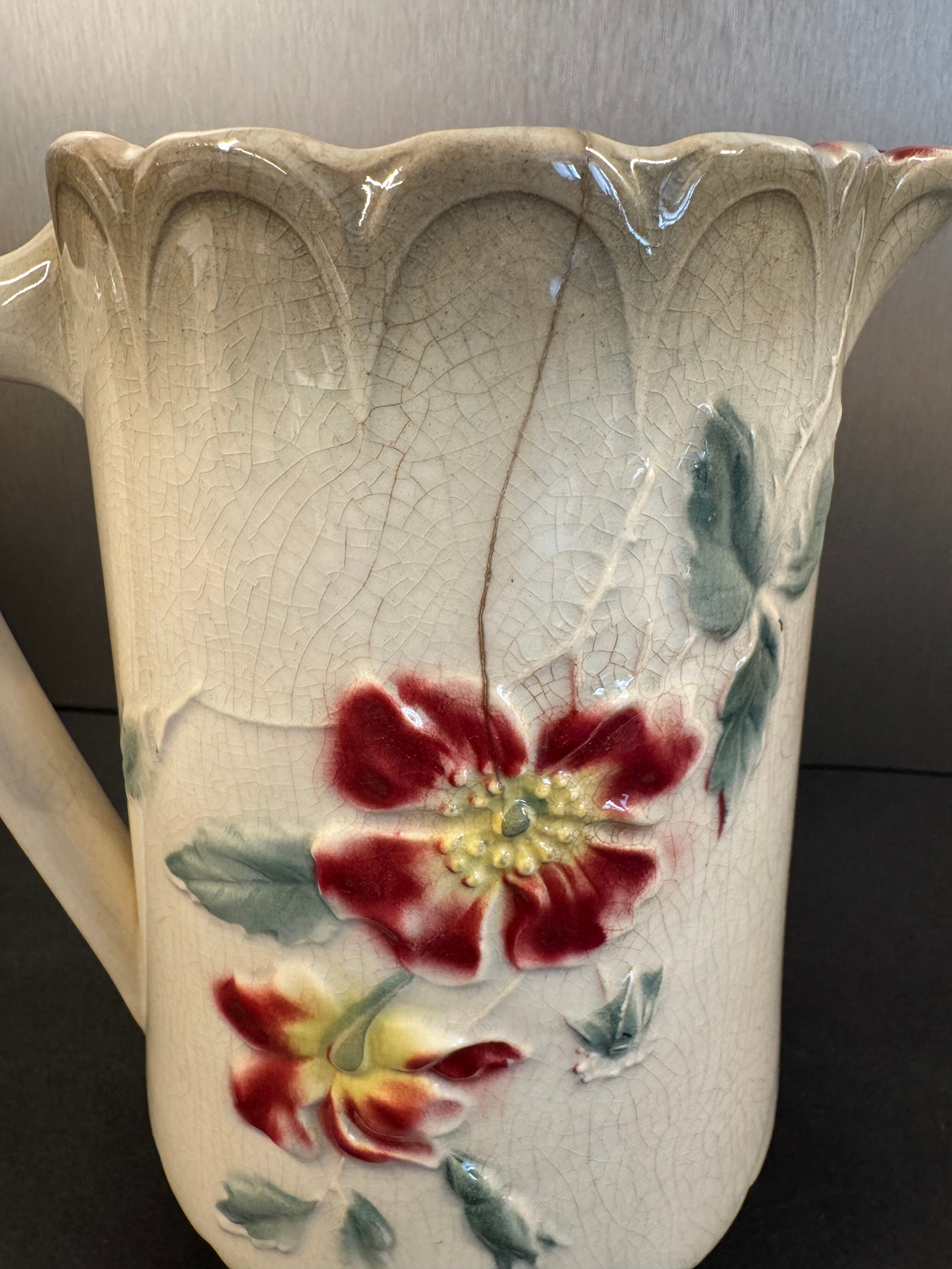 Antique pitcher in slipware with floral decoration – red and cream floral design