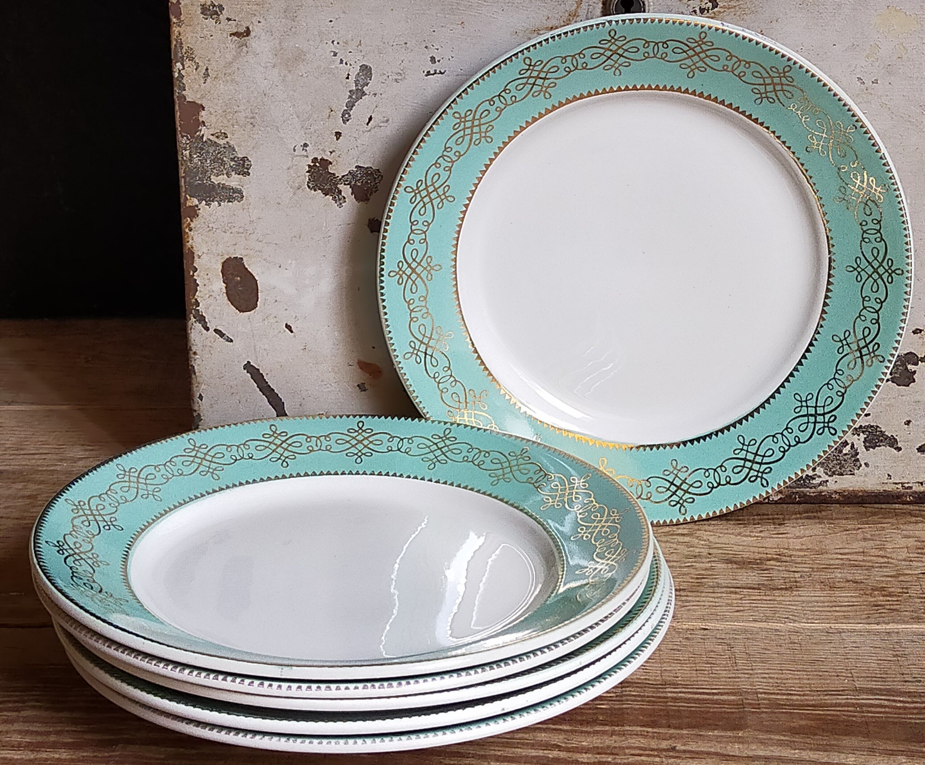 Six plates of vintage Badonviller earthenware with gold frieze