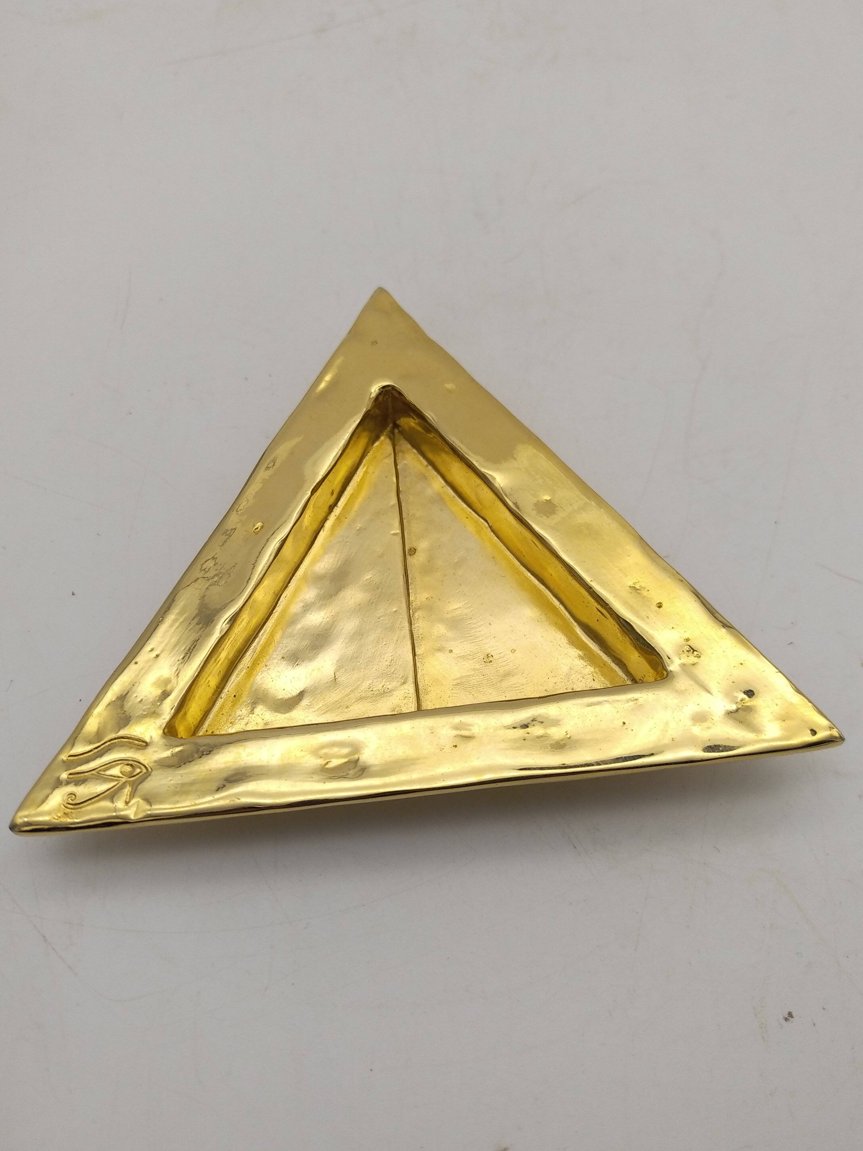 Cecile & jeanne: triangular gold-plated metal pocket tray with hieroglyph decoration.