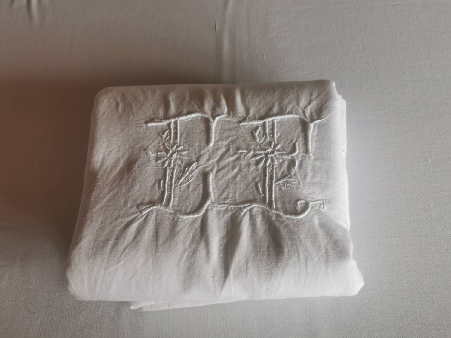 Old large monogrammed sheet hand-embroidered.