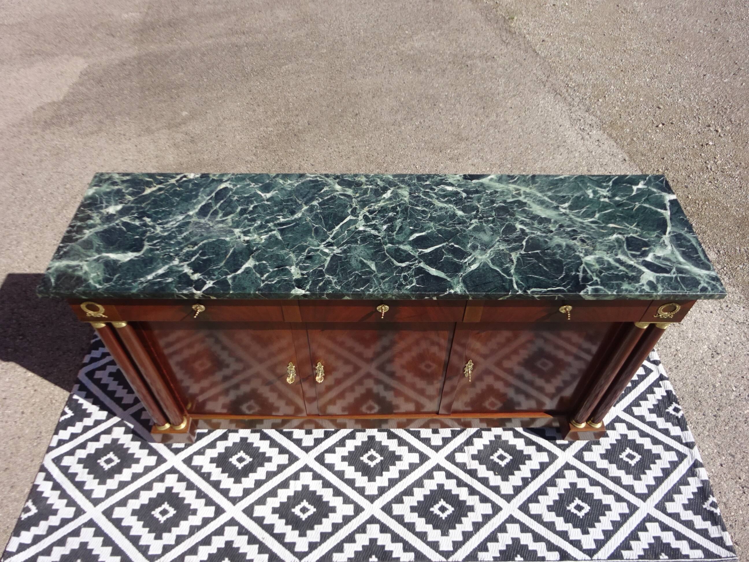 Flamed mahogany enfilade with sea green marble in Empire style.