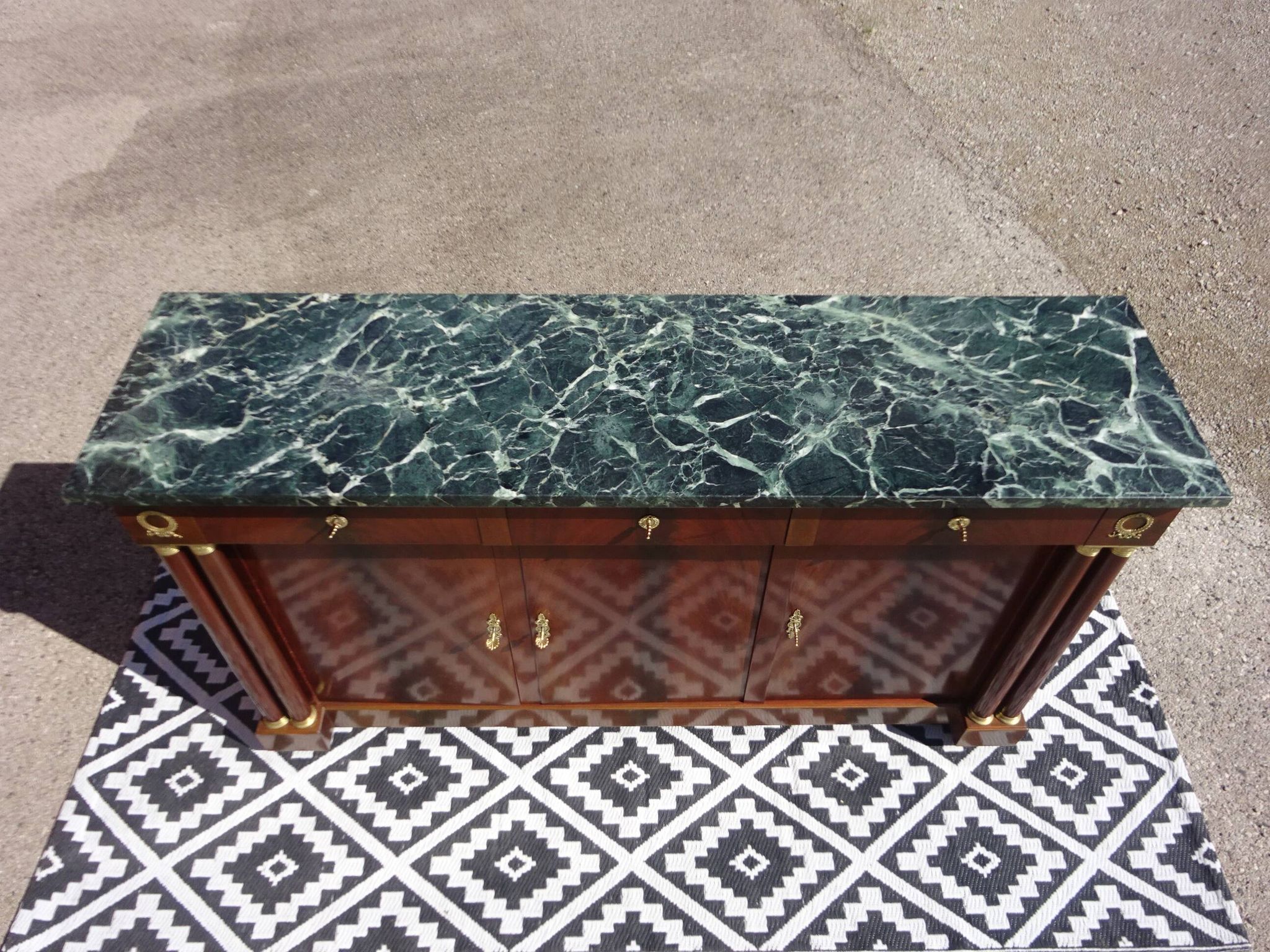 Flamed mahogany enfilade with sea green marble in Empire style.