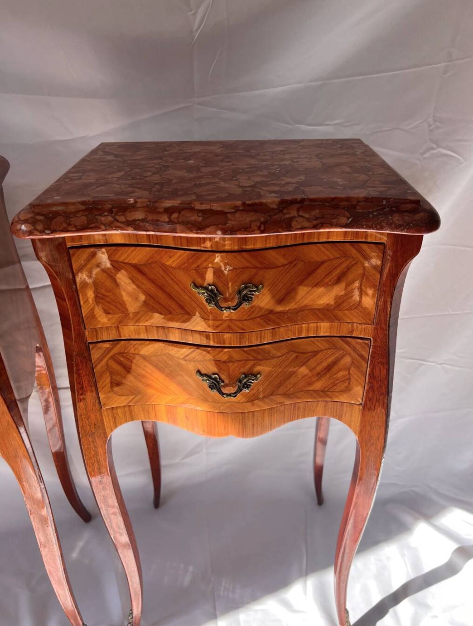 Pair of French rosewood bedside tables, marble top, inlaid beds.