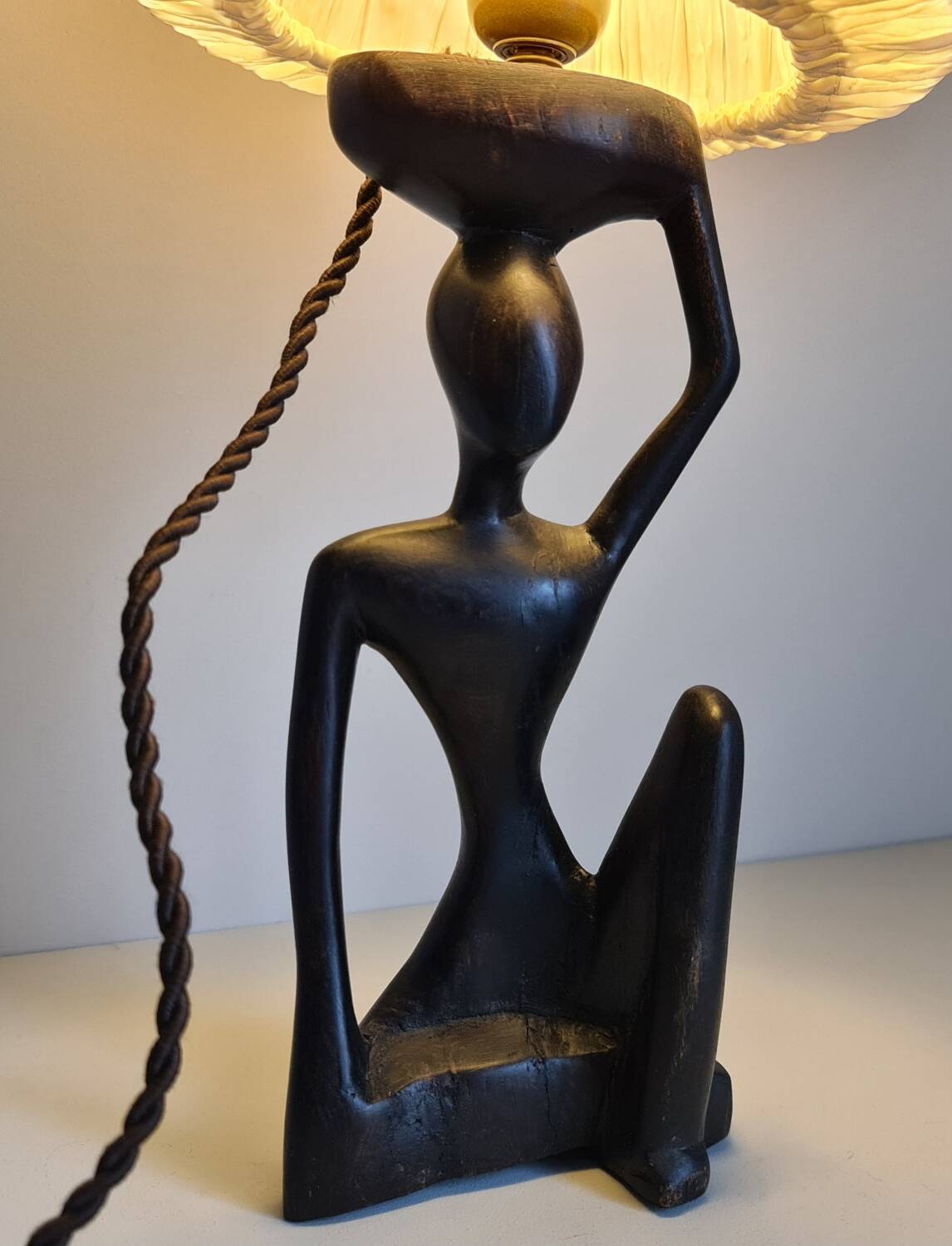 Ebony lamp with seated woman / 1930s