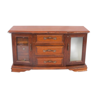 Wooden jewelry box in the shape of a chest of drawers