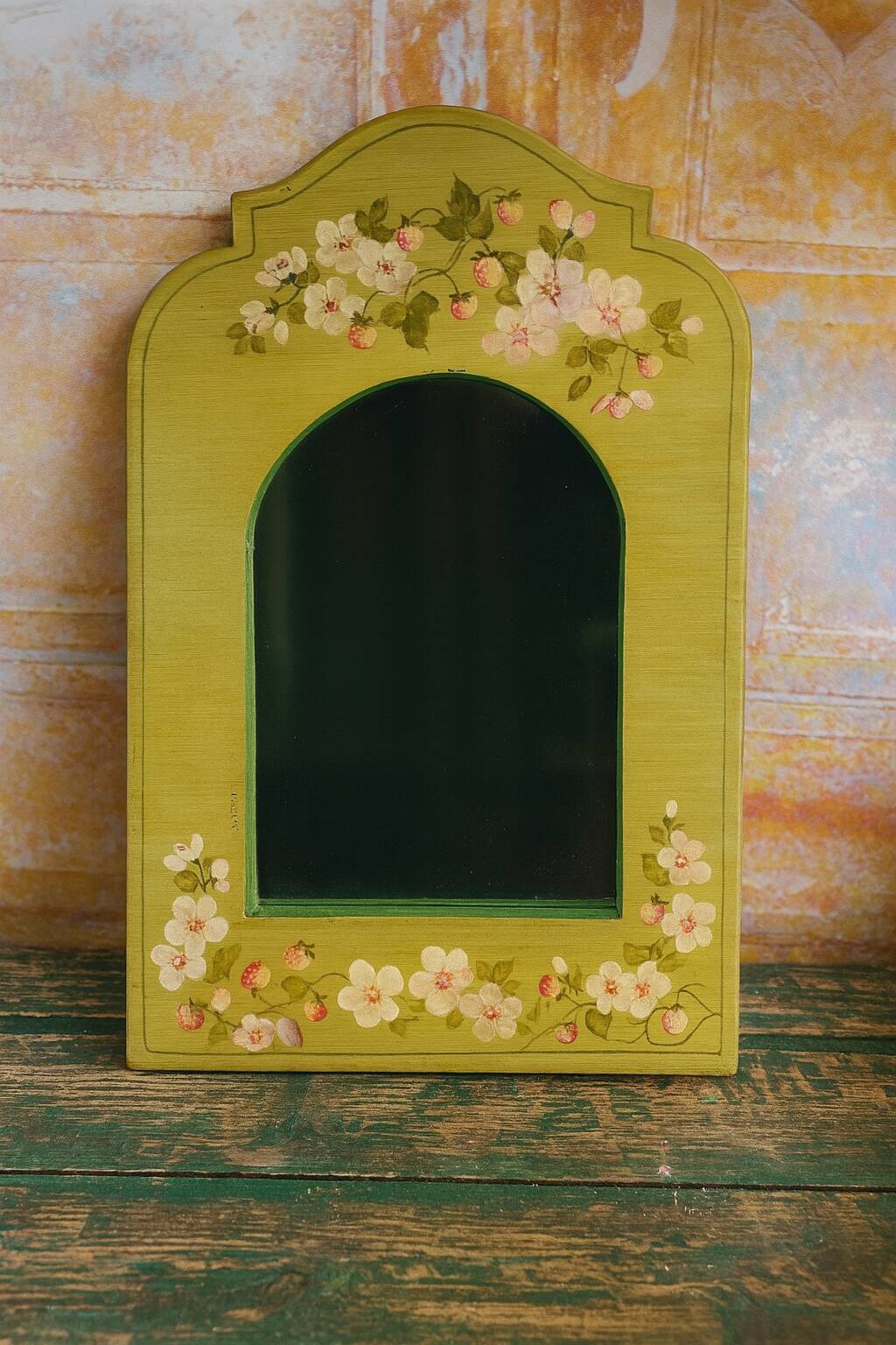 Shabby green mirror with flowers