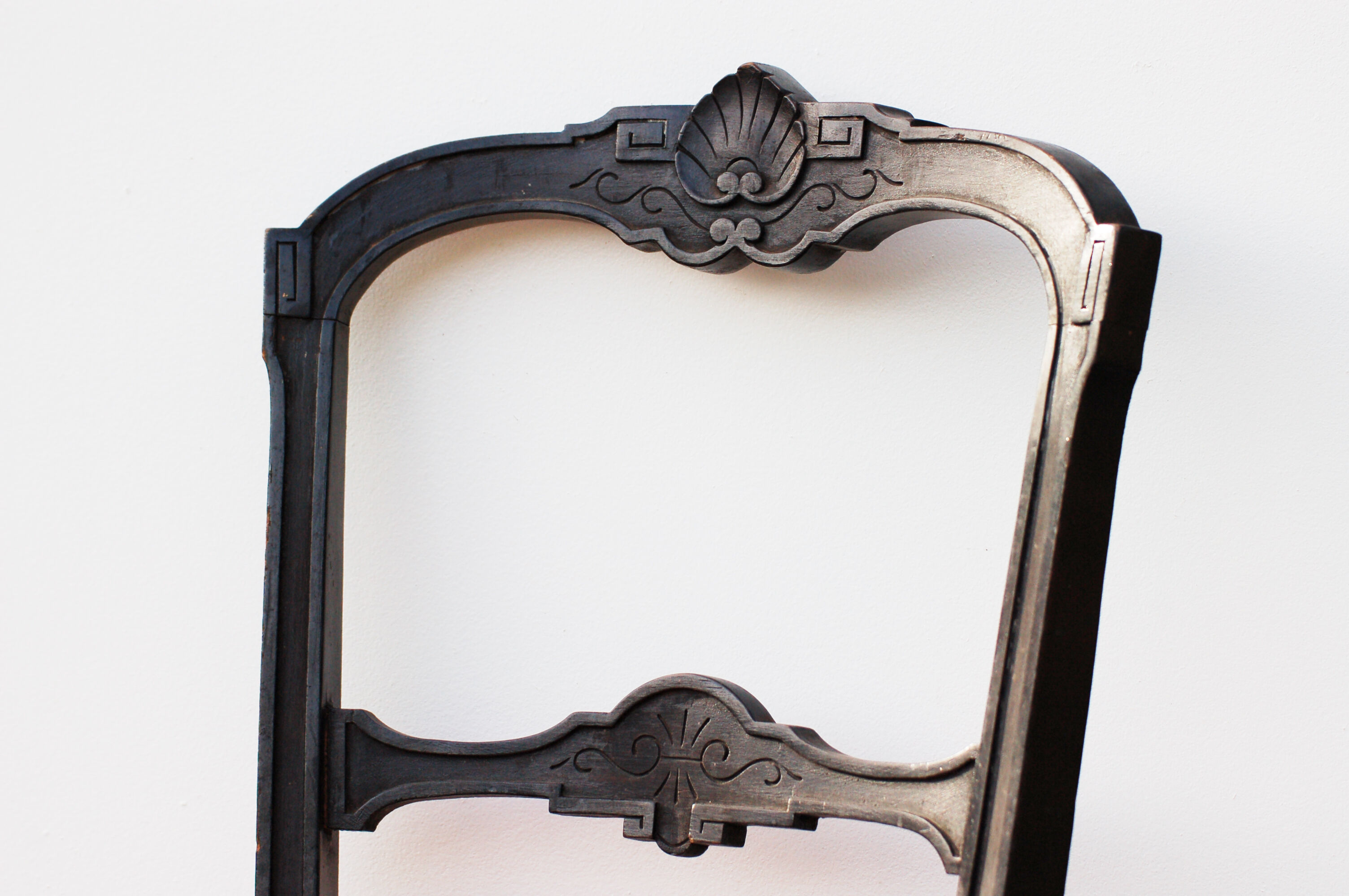 Pair of old black wooden chairs and Red seat.