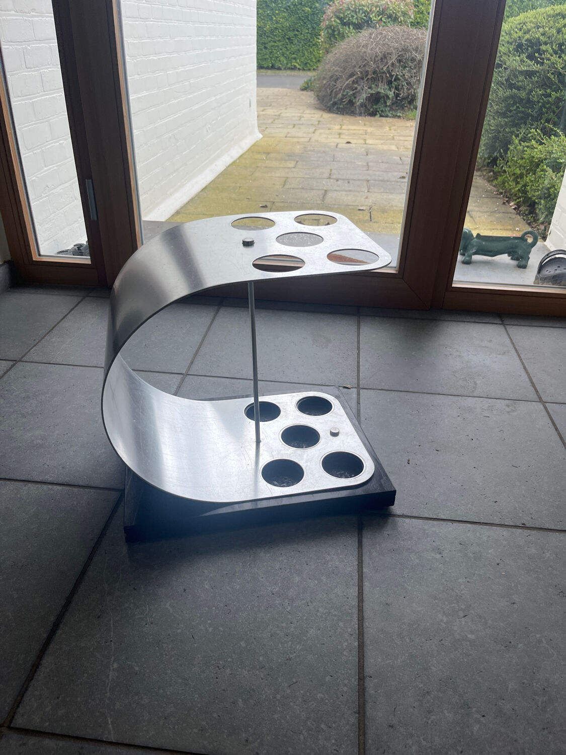 A modernist ebonised and aluminium umbrella stand