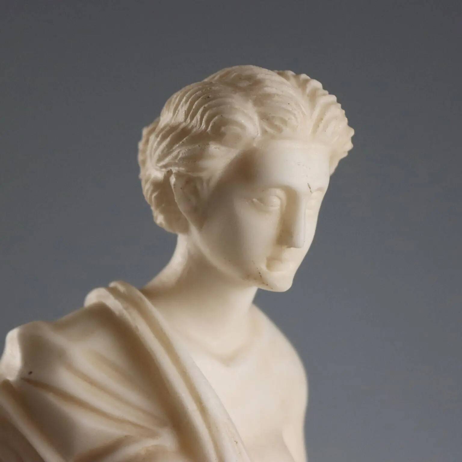 Sculpture of a Roman matron in white marble, Italy, 19th century.