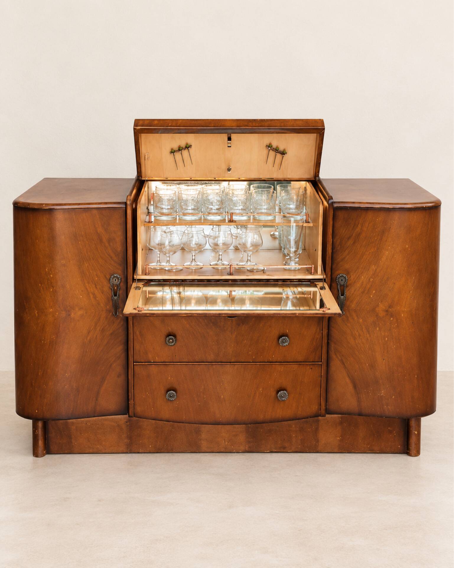 Art Deco walnut bar cabinet with a mirrored interior.
