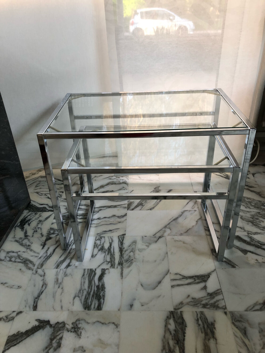 Nested tables in chrome metal and glass, Italy circa 1970.