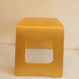 Design stool/side table made of curved plywood.