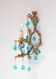Italian wall sconce in gilded iron and turquoise blue crystals, circa 1960.