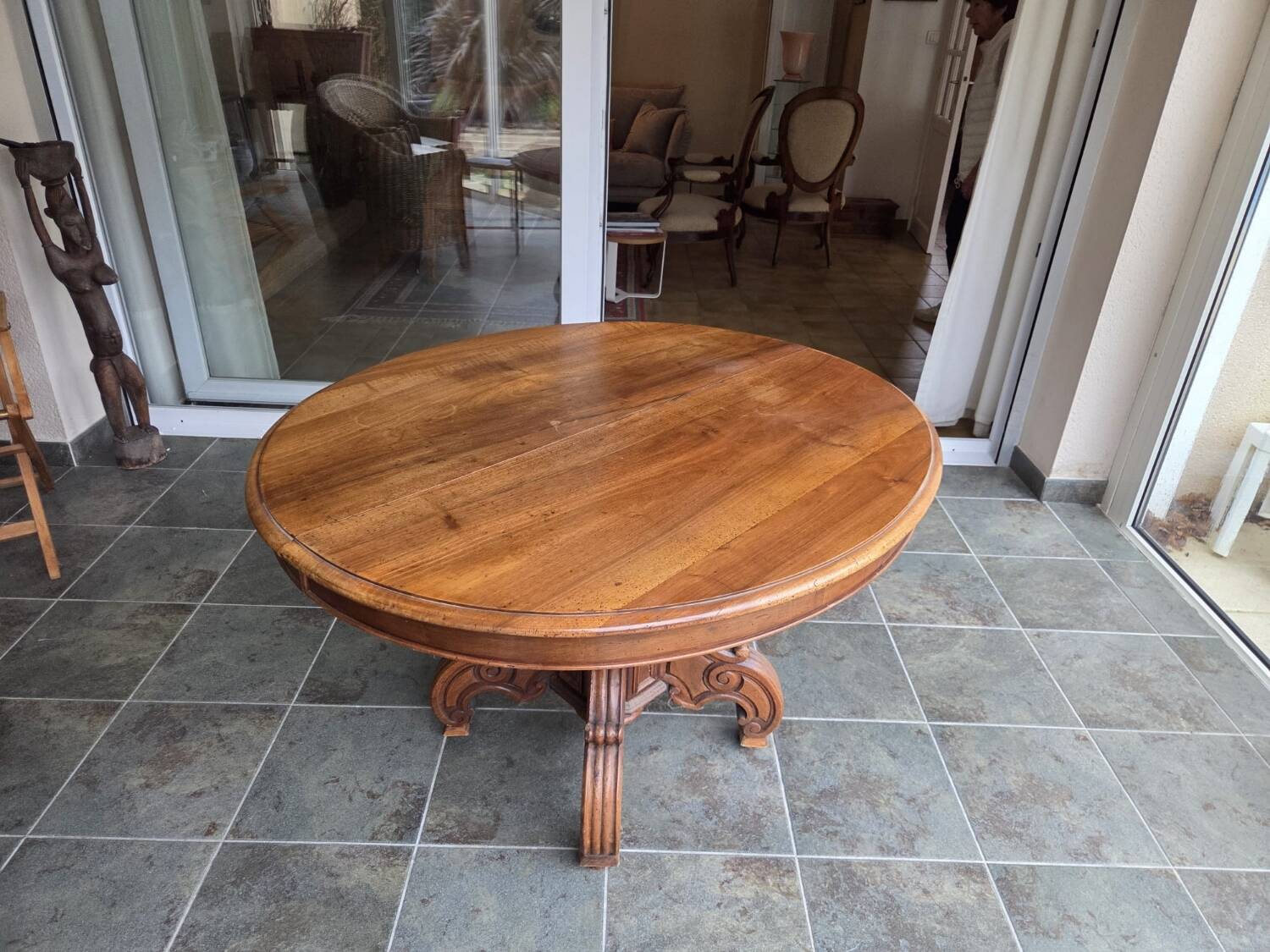 Extendable walnut table in the Napoleon III style.
