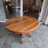 Extendable walnut table in the Napoleon III style.
