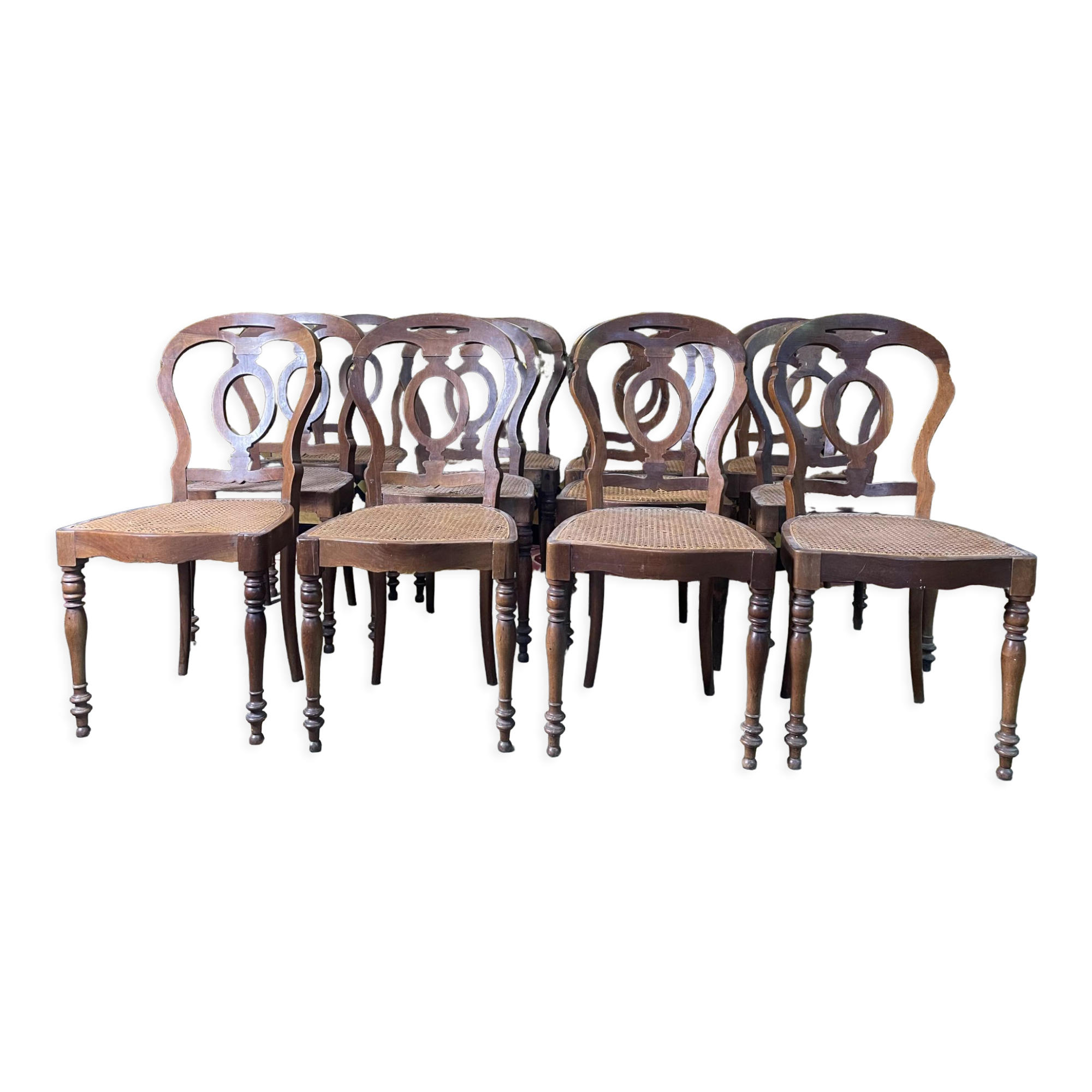 Suite of 12 Louis Philippe period chairs in walnut and canning