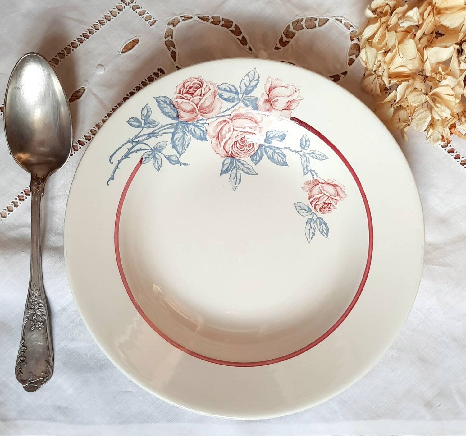 Mismatched old soup plates accompanied by a soup tureen