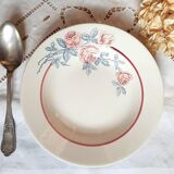 Mismatched old soup plates accompanied by a soup tureen