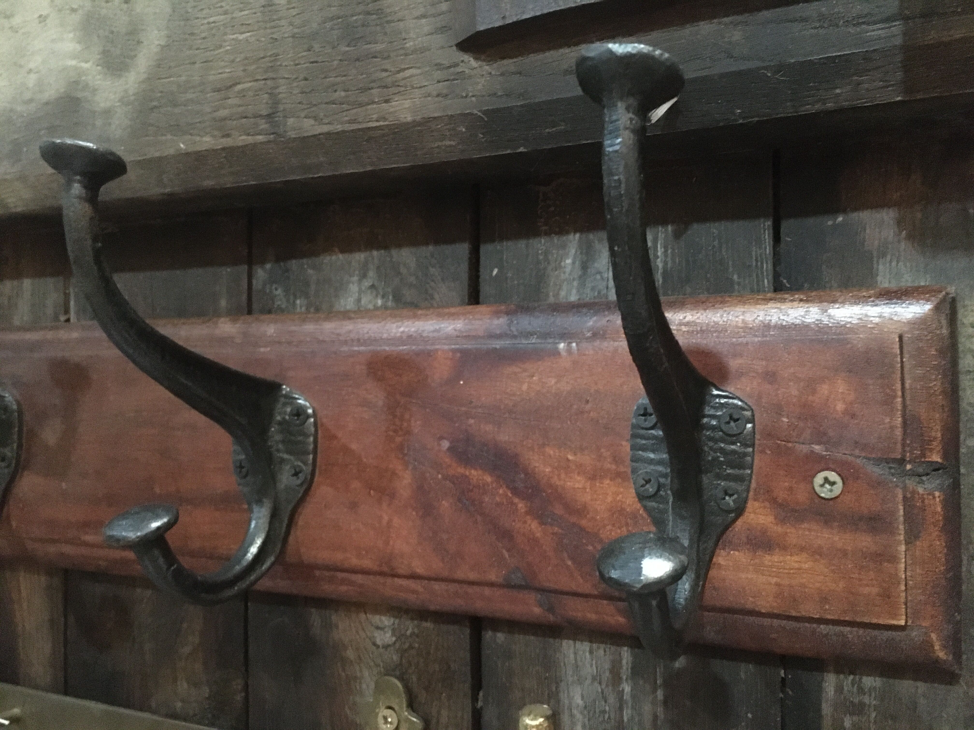 Metal patère on wood