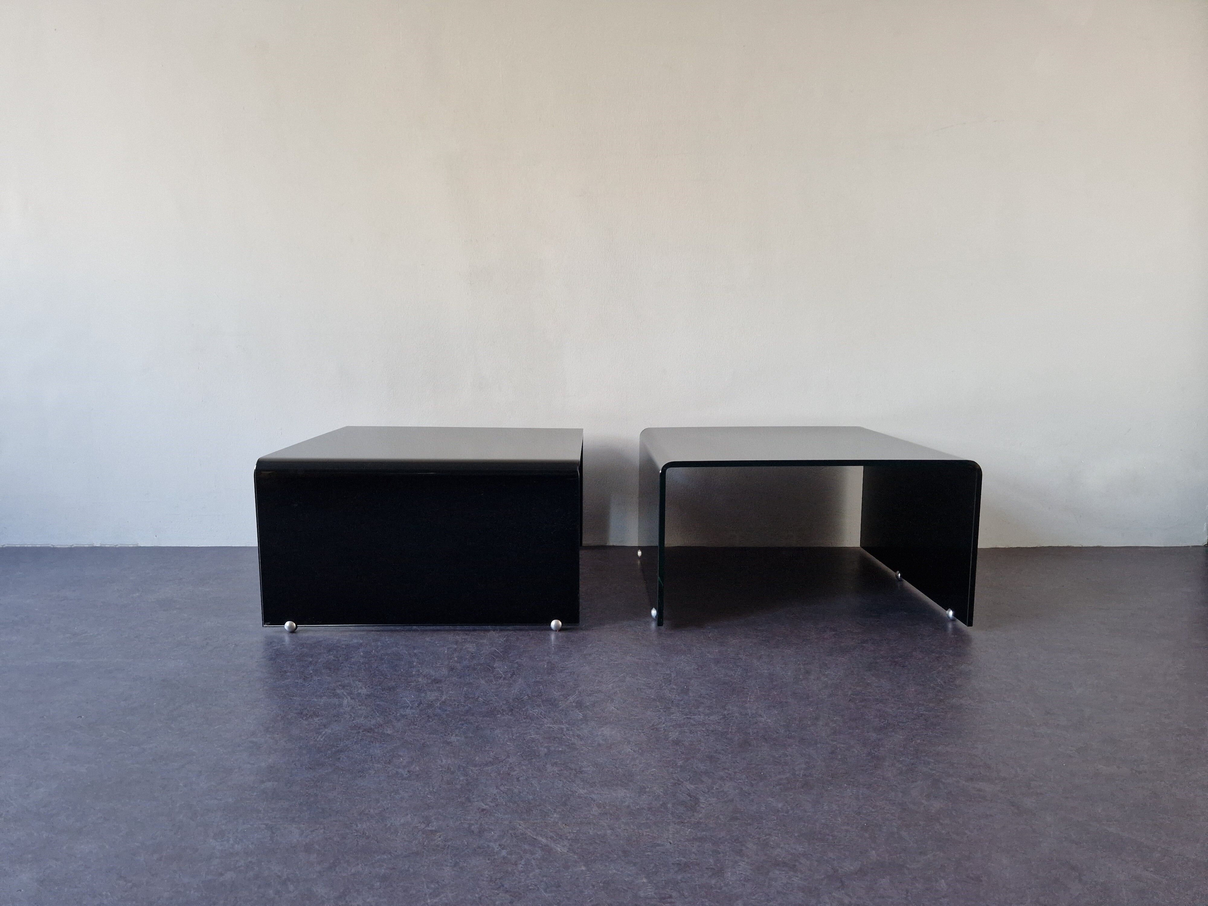 Bended black glass coffee table