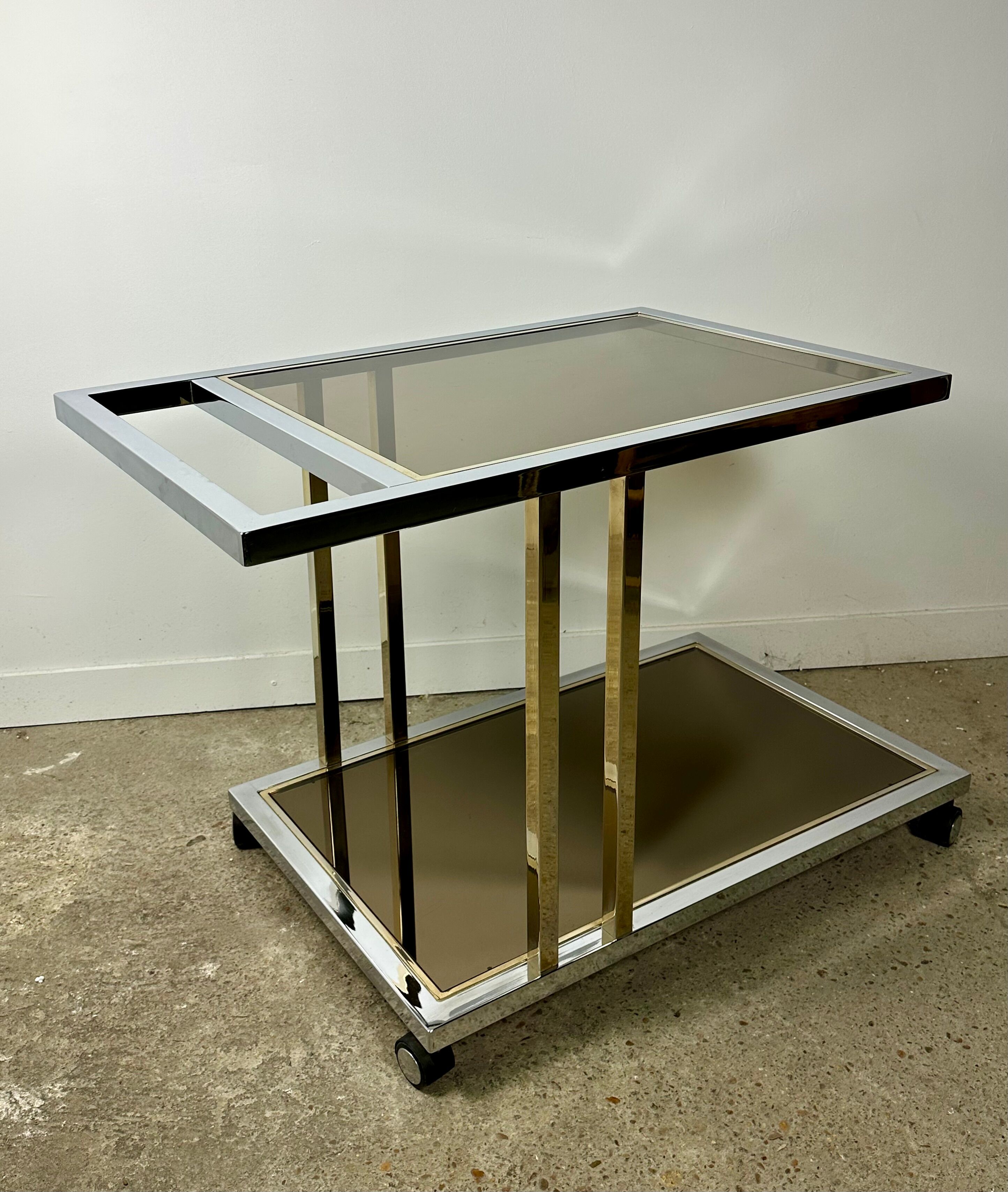 Belgo chrome serving cart/rolling table in chromed and gold-plated brass, 70s