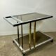 Belgo chrome serving cart/rolling table in chromed and gold-plated brass, 70s