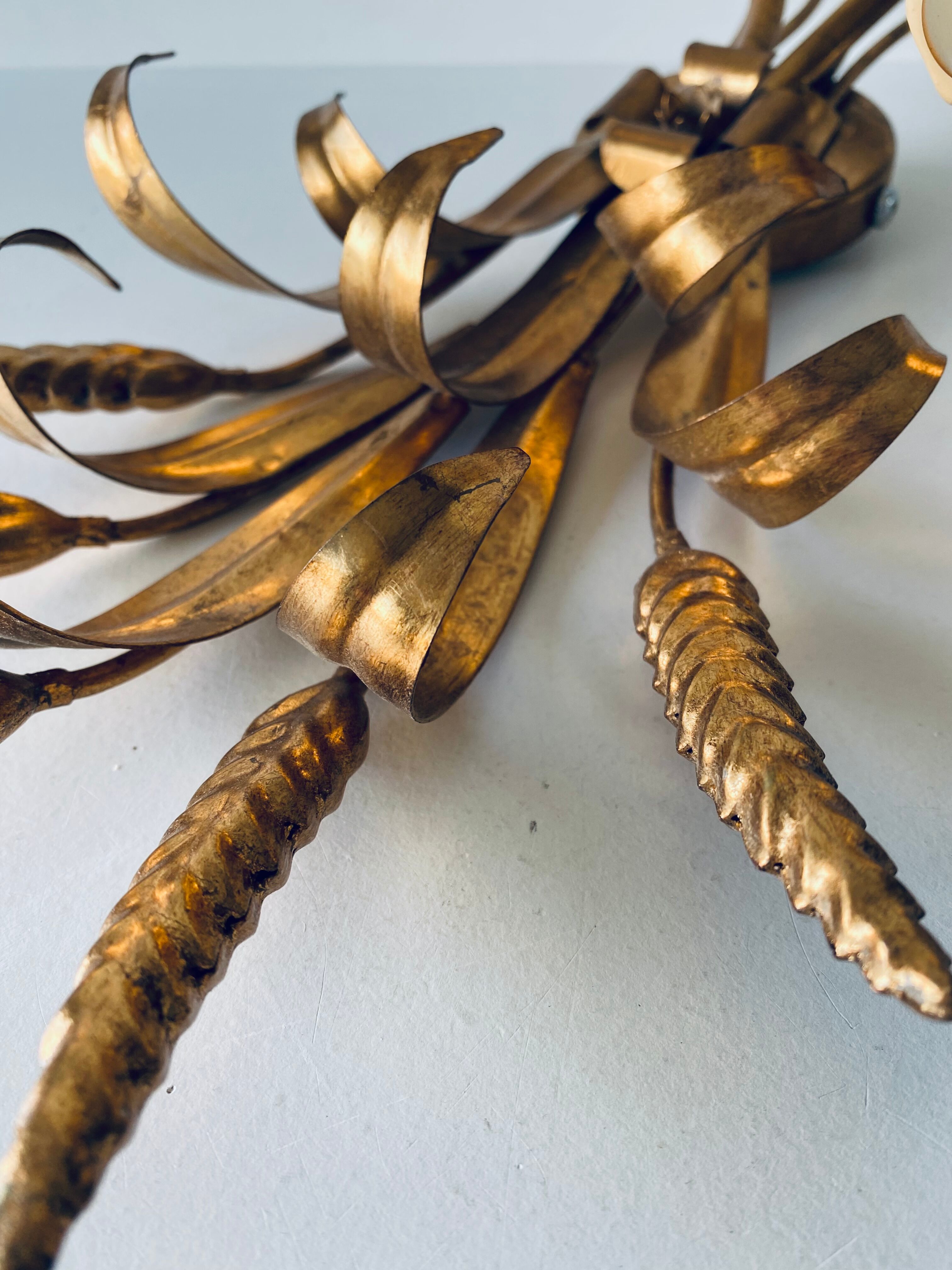 Double golden spike wall lamp