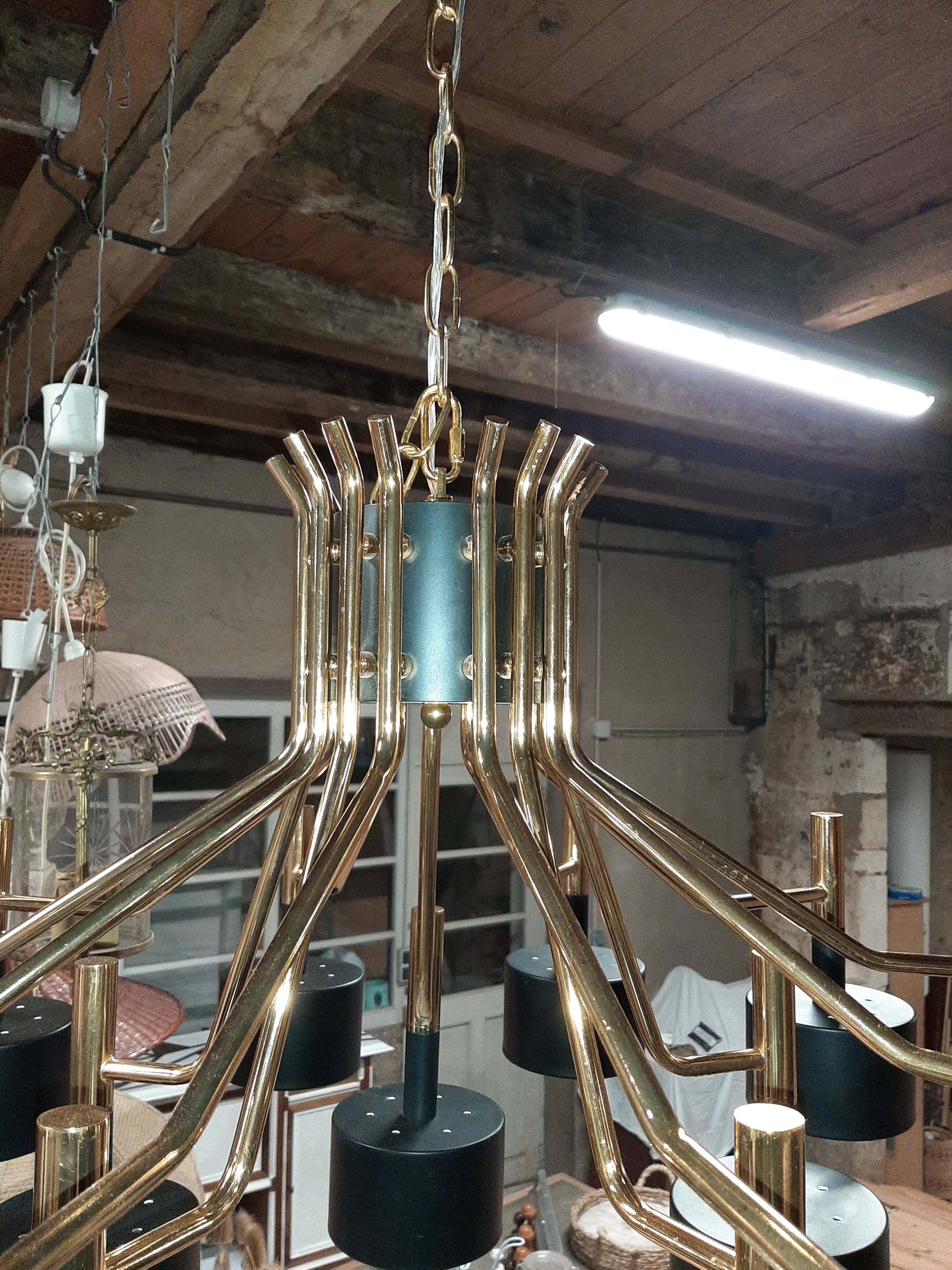 Black chandelier and gilded metal