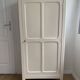 Vintage Parisian wardrobe painted in linen white, one door, three shelves