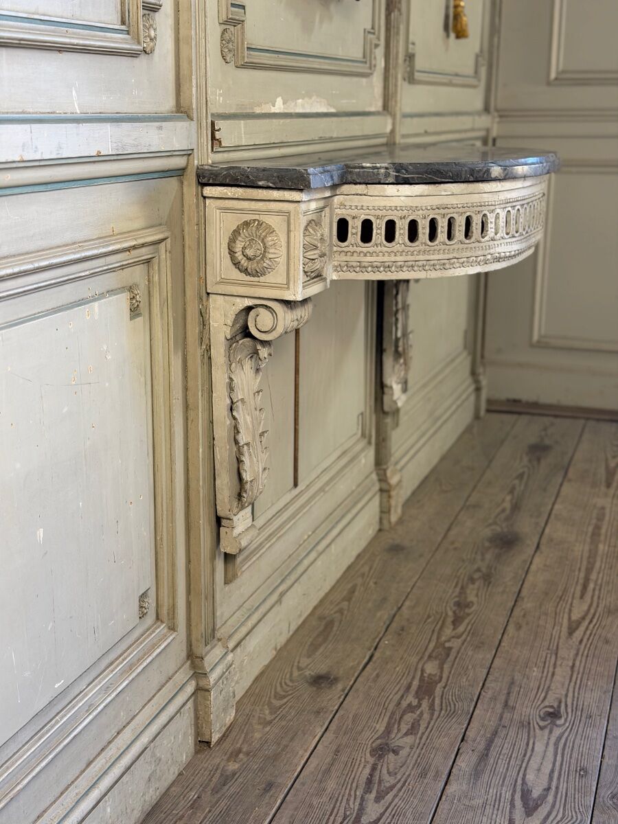 Louis XVI wall console in carved wood, grey patina, 18th century.