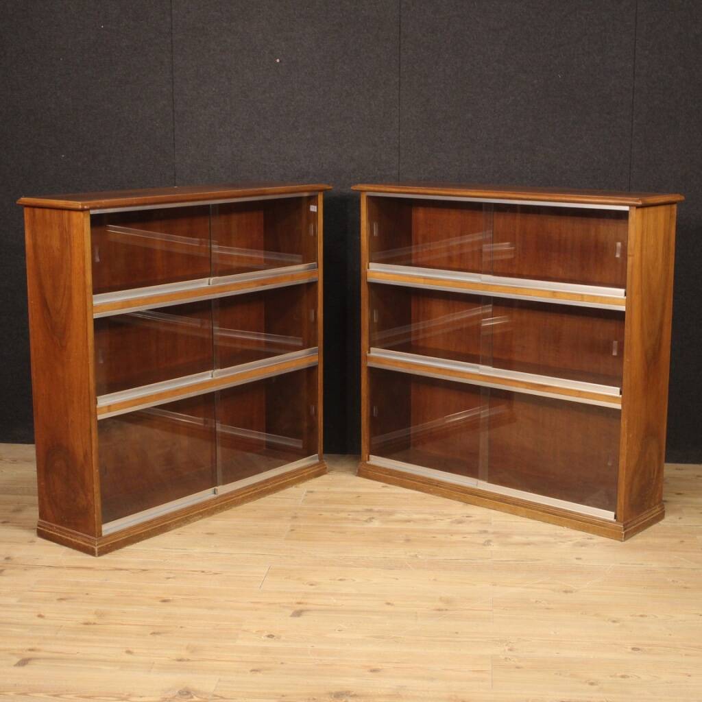 Pair of Italian bookcases in walnut wood with glass doors