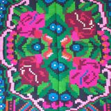 Handwoven colorful Romanian carpet, green and black background with gorgeous colorful flowers