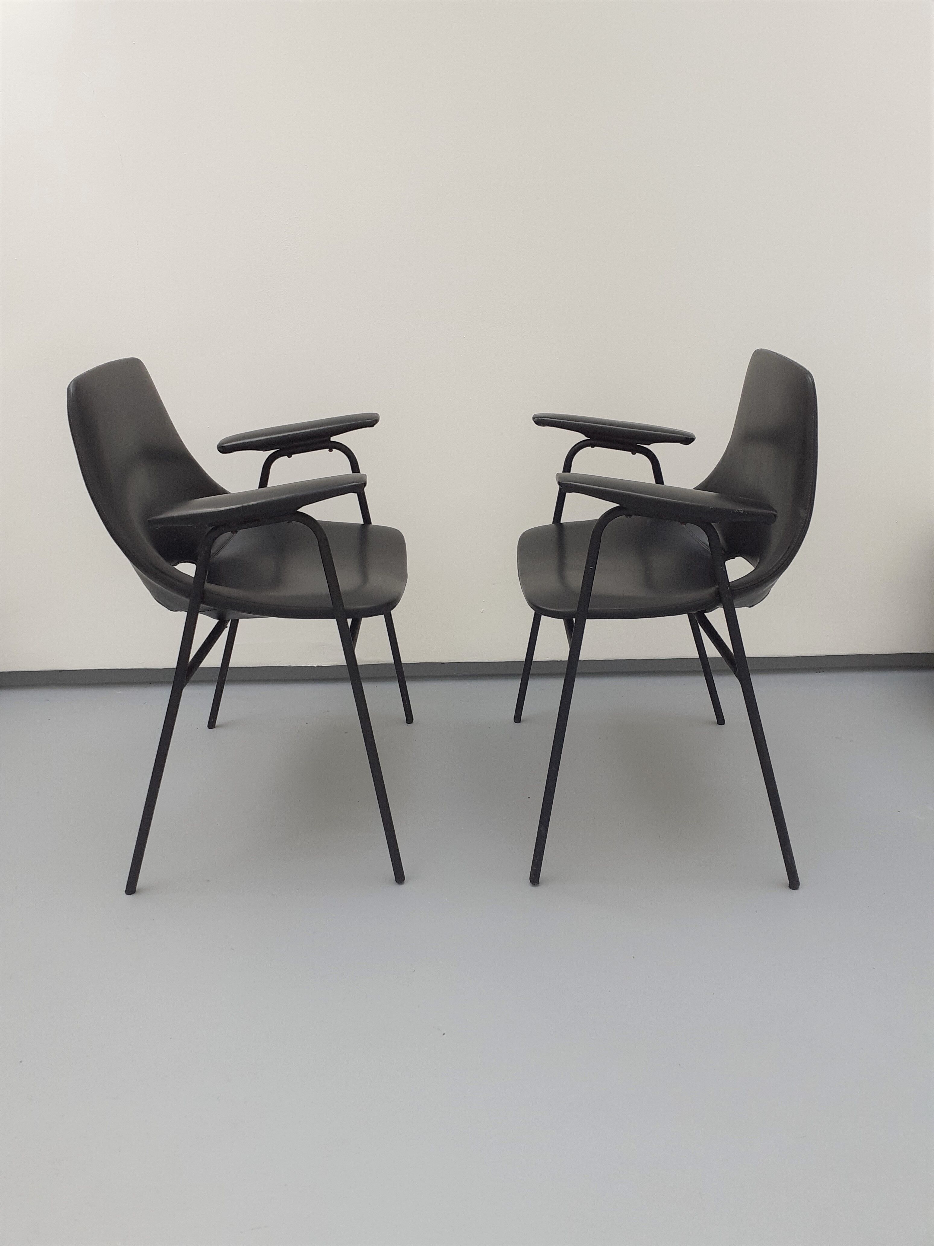 Pair of armchairs, Tonneau model, in black skai by Pierre Guariche, 60s