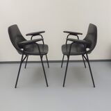 Pair of armchairs, Tonneau model, in black skai by Pierre Guariche, 60s