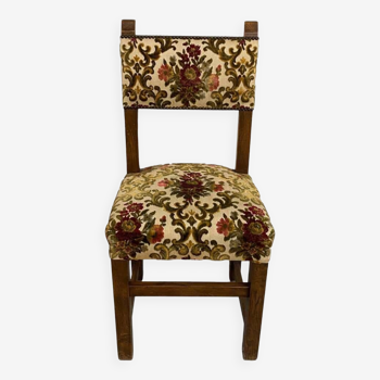 Antique chair upholstered in solid wood