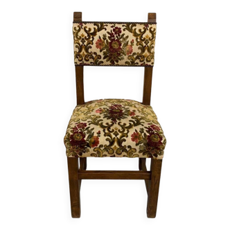 Antique chair upholstered in solid wood