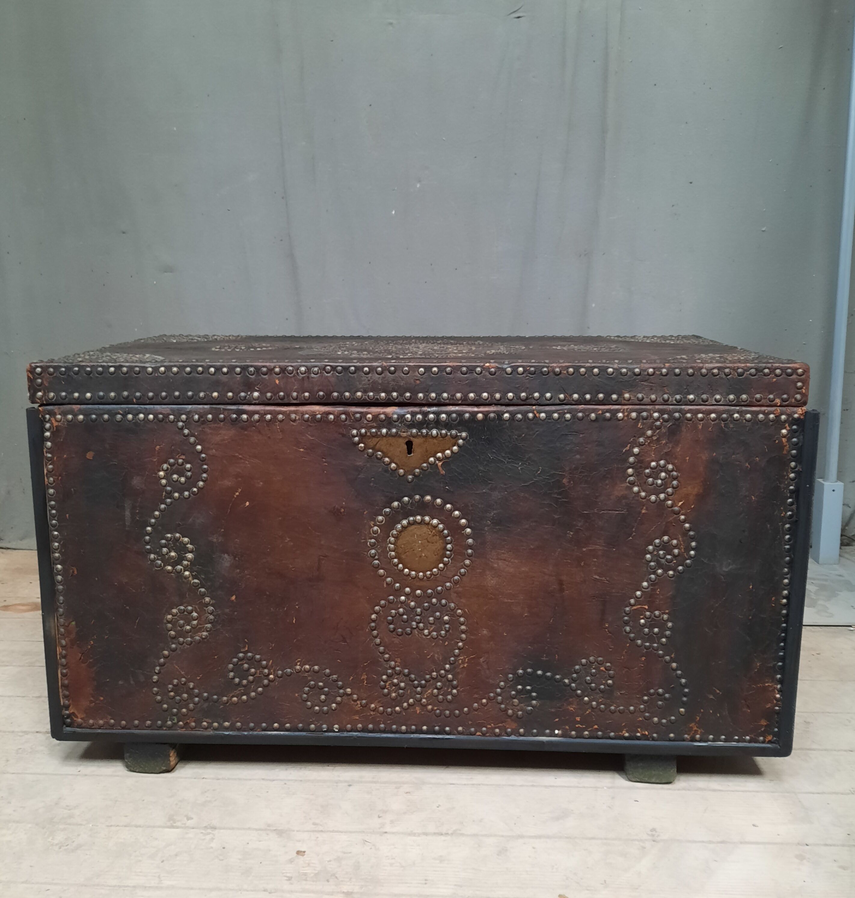 Chest covered with leather and nails