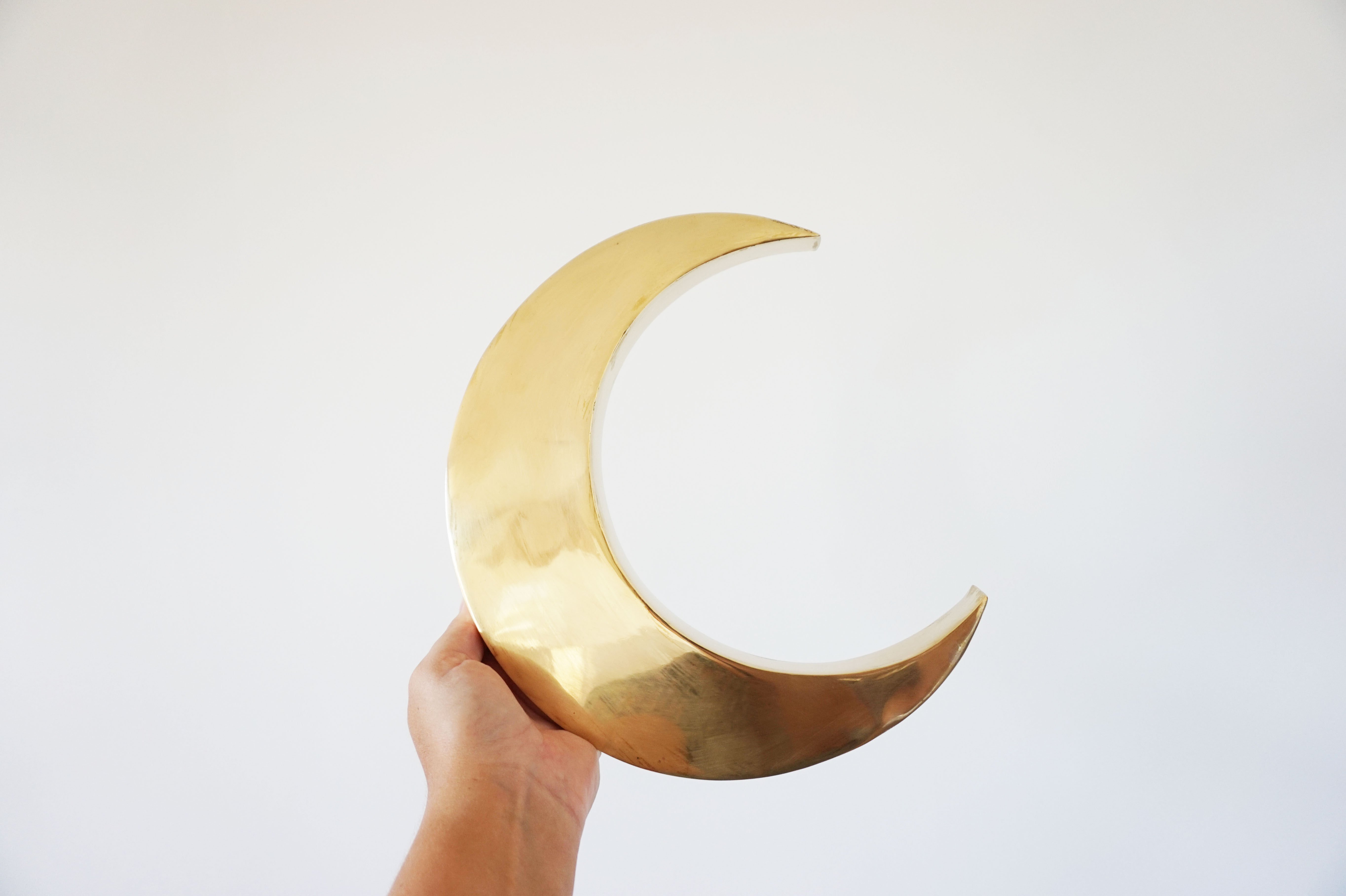 Moon or letter of sign "C" in vintage brass