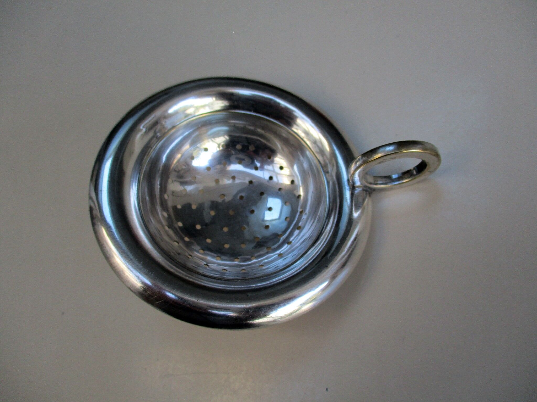 Silver metal tea strainer