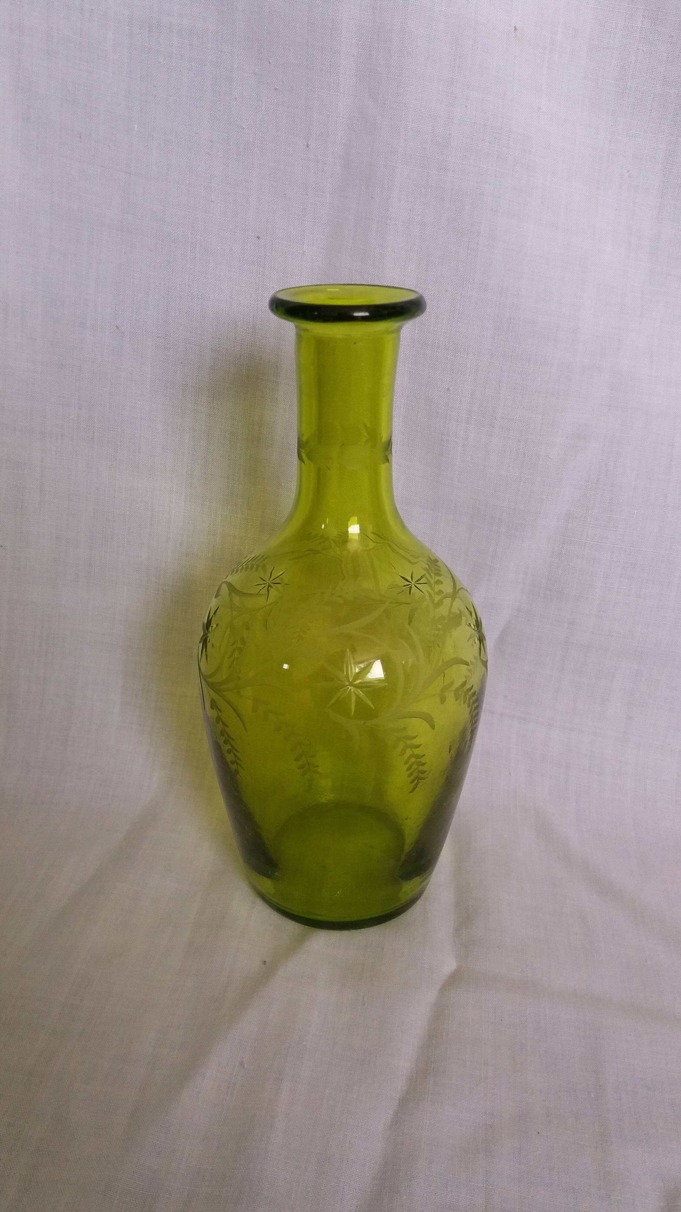 Cut and engraved green blown glass carafe vase